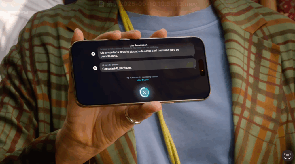 Close-up of iPhone 17 showing face-to-face translation with one user, displaying real-time Spanish to English conversation on screen.