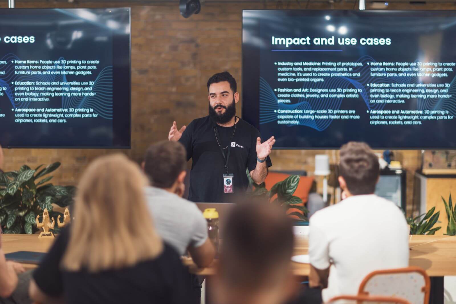 A technology presenter demonstrating product use cases to an audience.